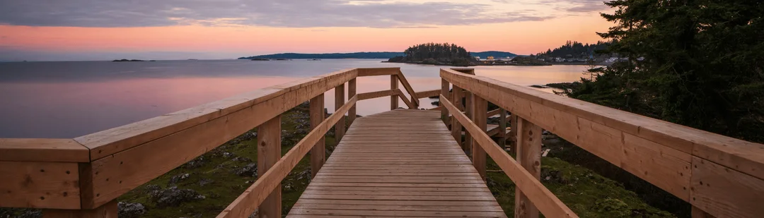 Wooden steps leading down to the shore in the Hammond Bay guide