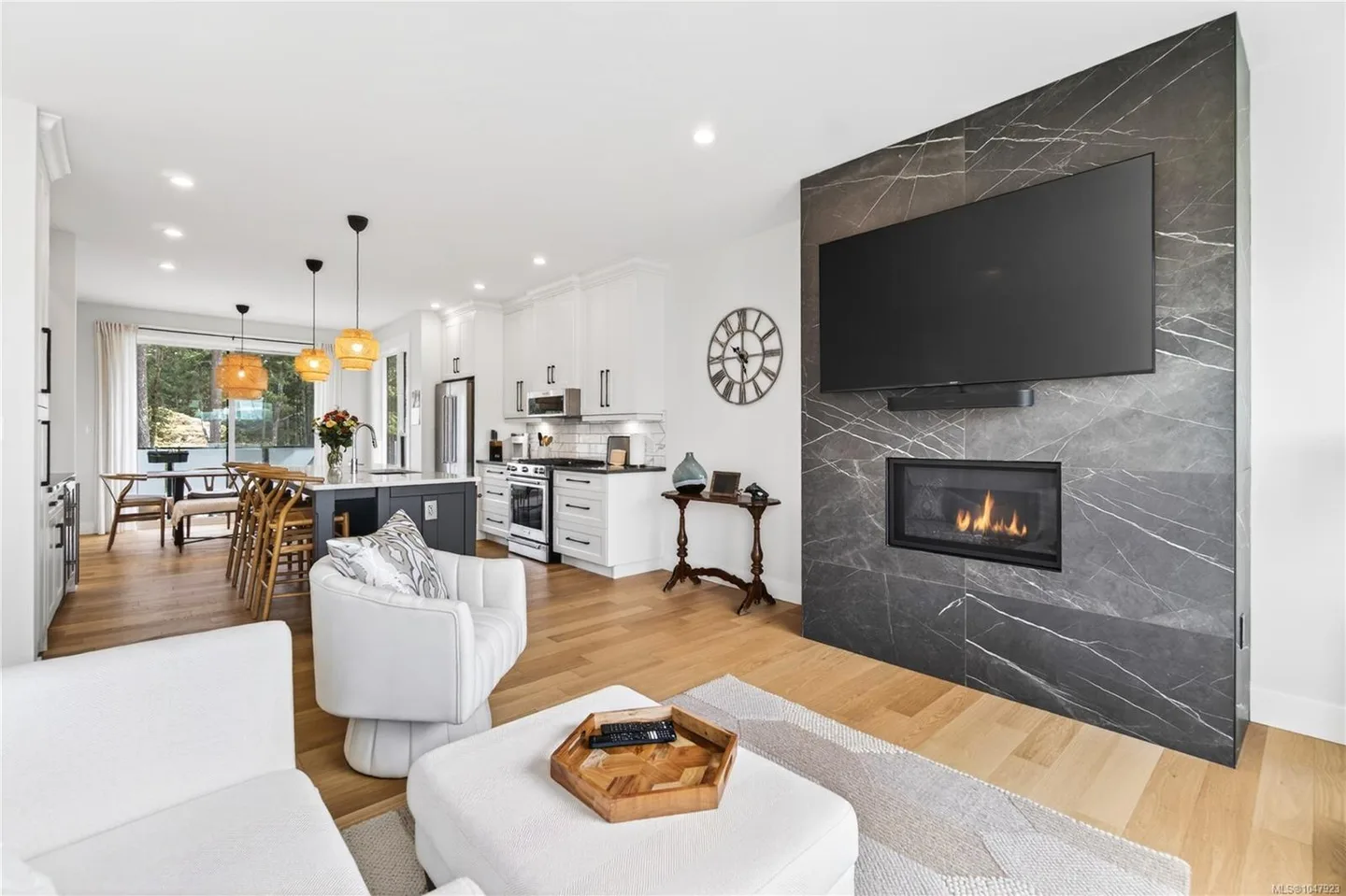 Manzanita’s living area, with the fireplace in the foreground and the kitchen and dining area beyond